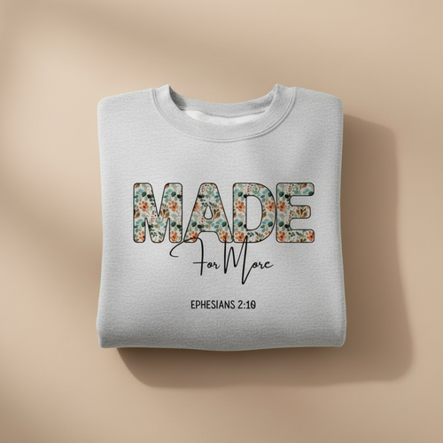 Folded Sweatshirt on Tan Background